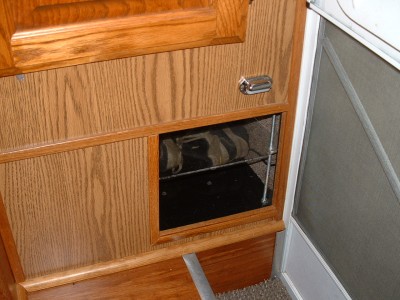 Fixture above the cubby is a light for the entry steps. Old step light came out when we redid the flooring.